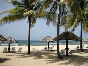 On the beach, sun loungers, beach towels