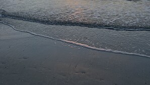 A beach with waves and a sunset. - Key West Style Florida Charm w Heated Private Salt Pool, close walk to Beach (Marco Island)