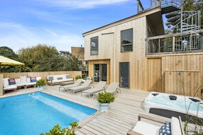 Outdoor pool, a heated pool - Escape to this FIRE ISLAND PINES BEACH HOME with Heated Salt Water Pool (Sayville)