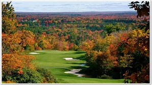 A golf course with a clear view of the surrounding forest and distant hills. - Perfect Getaway In The Poconos! (House #1) HotTub !! Gameroom!! WiFi !! (Albrightsville)