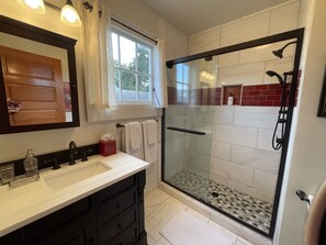 Bathtub, hair dryer, towels, soap