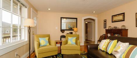 Flat-screen TV, DVD player, books, video library