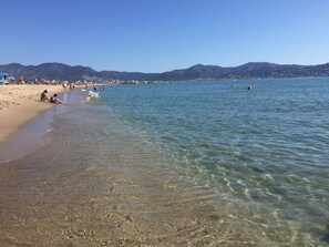 On the beach, sun-loungers