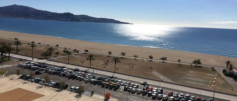 On the beach, sun-loungers