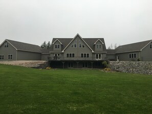 Back of house garage on one side pool house on other side