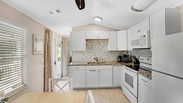 Fridge, microwave, stovetop, cookware/dishes/utensils