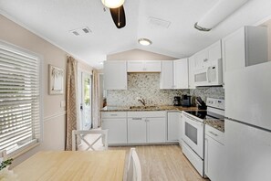 Fridge, microwave, stovetop, cookware/dishes/utensils