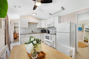 Fridge, microwave, stovetop, cookware/dishes/utensils