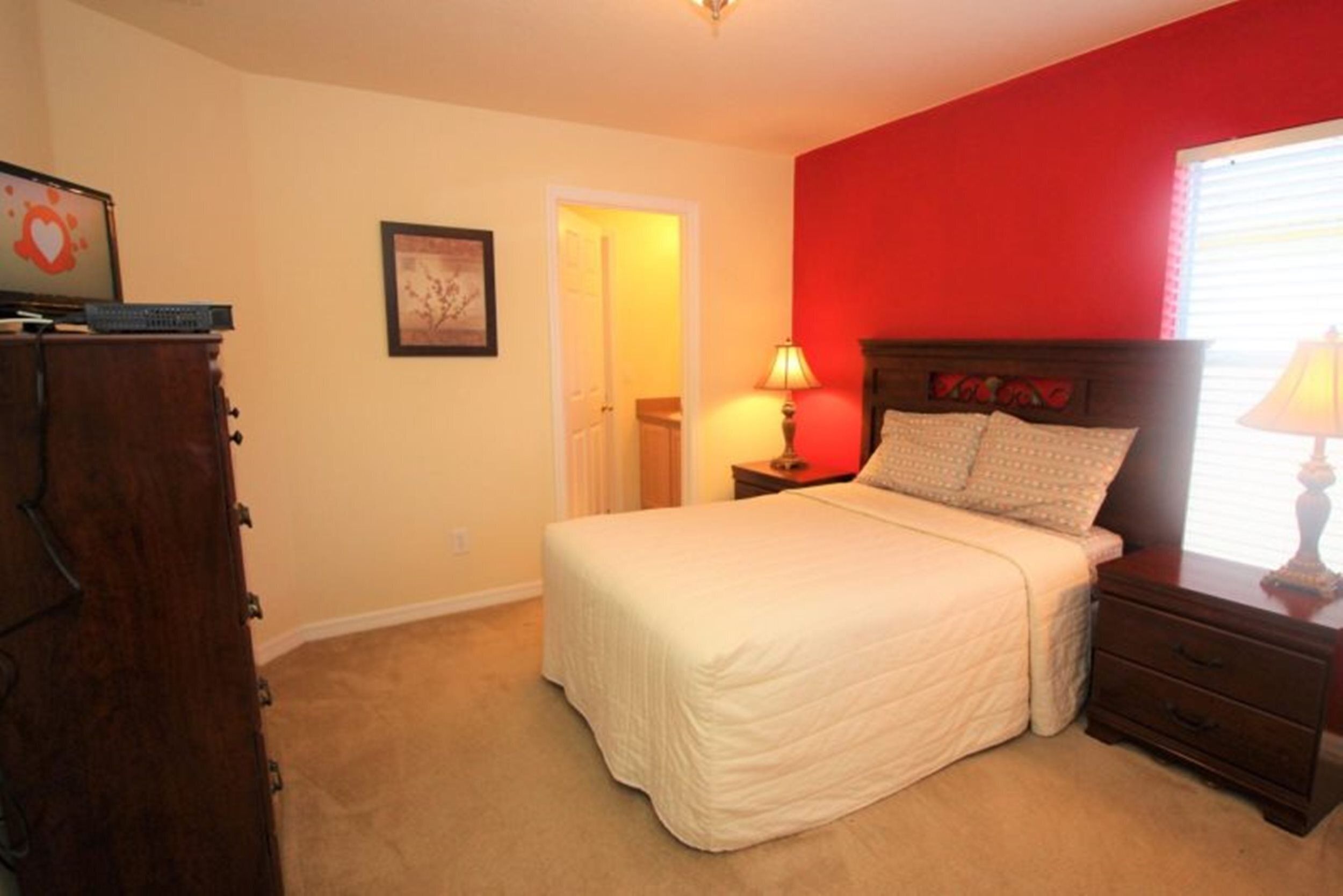 Queen room with TV and attahched 3 pc bath
