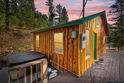 Mountain-side Cabin with hot tub! Close To Town And Skiing on 1.1 acres.