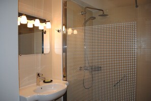 Shower, hair dryer, towels, soap