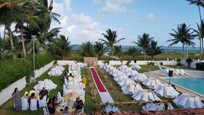 Outdoor banquet area - Excellent beachfront house with pool, swim-up bar, and mini soccer field. (Pilar)