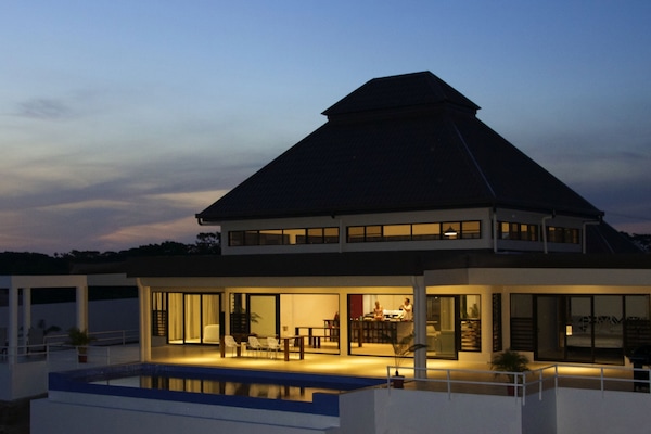 Infinity pool and outdoor space at sunset
