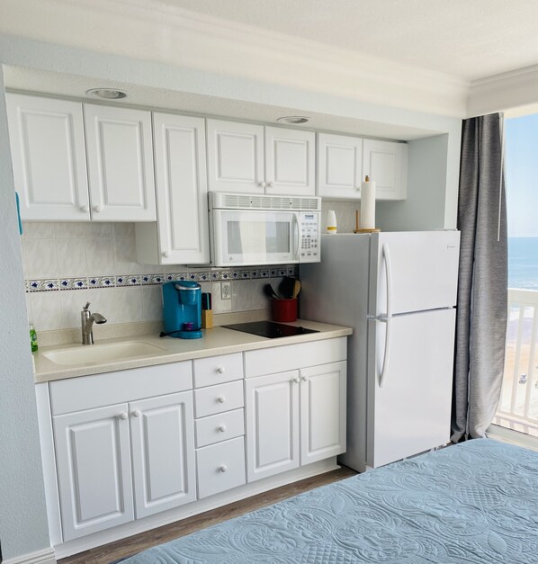 Fridge, microwave, stovetop, coffee/tea maker