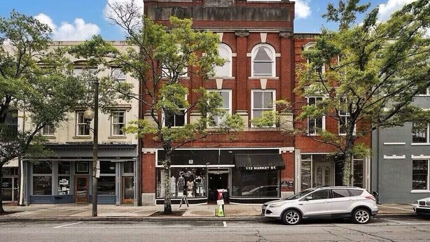 A two-story building with a brick facade and large windows. - The Gallery Getaway in the Heart of Historic, Riverfront Wilmington!  (Wilmington)