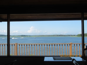 Enjoy breathtaking views of the water from this room's balcony.