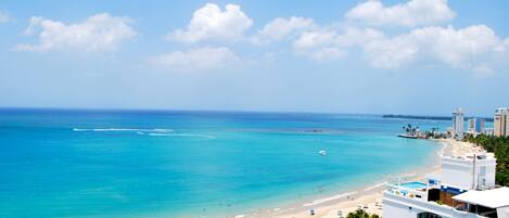 On the beach, sun-loungers, beach towels