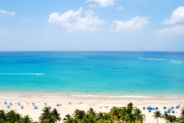 On the beach, sun-loungers, beach towels