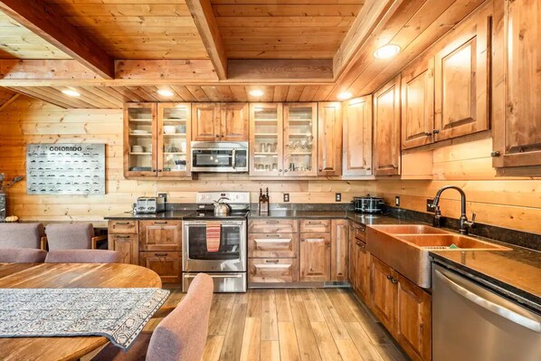 Enjoy cooking and dining in this well-equipped kitchen with a central island and dining area.