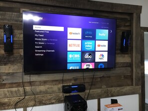 70” TV with Roku and surround sound 