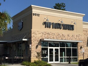A building with a sign reading "Top Dawg Tavern" and the number 9512. - Southern sophistication at Ashley Ridge (Summerville)