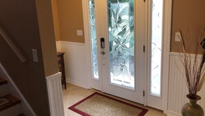 A hallway with a double door featuring frosted glass panels and a decorative glass design. - Perdido Key/Pensacola Pass sleeps 14 (Pensacola)