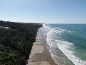 On the beach, sun-loungers