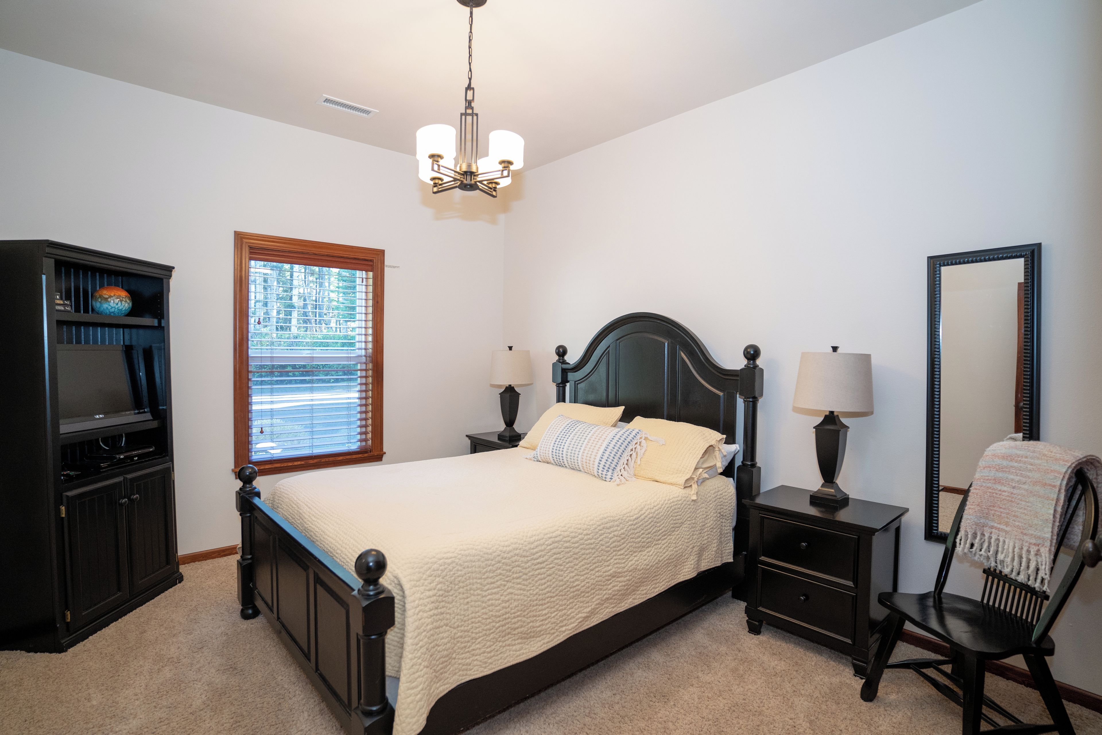 Bedroom cozy with bath tub shower next to it