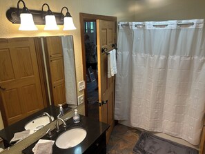 Combined shower/tub, hair dryer, towels, soap