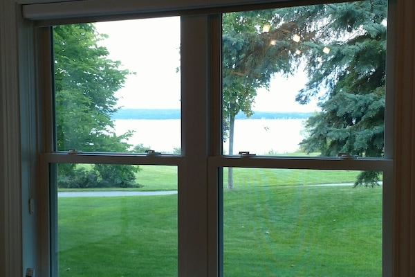 View from Living Room of bicycle trail and water in bay.