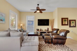 Flat-screen TV, DVD player, books