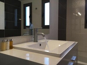 Bathtub, hair dryer, towels, soap