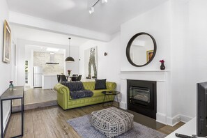 TV, fireplace, books