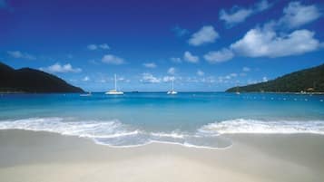 On the beach, sun-loungers, beach umbrellas, beach towels