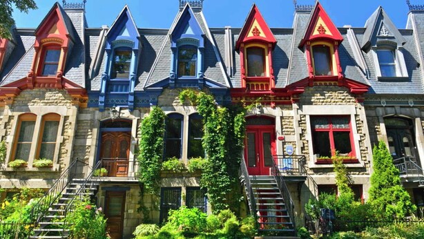 A row of Victorian-style townhouses with steep gabled roofs, stone facades, and colorful trim. - MTLVR #11 | Central, Group Friendly, Patio (Montreal)