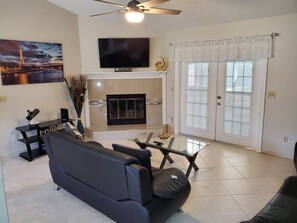 Smart TV, fireplace, table football, books