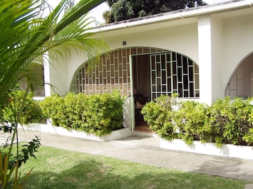Front of condo and enclosed patio (with security bars).