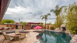 Outdoor pool, a heated pool - Central Oasis-Luxury Furnished Rental w/Waterfall, Grotto, & Outdoor Kitchen (Tucson)