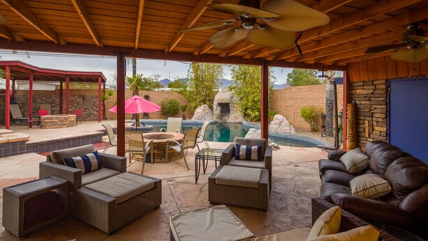 Outdoor dining - Central Oasis-Luxury Furnished Rental w/Waterfall, Grotto, & Outdoor Kitchen (Tucson)
