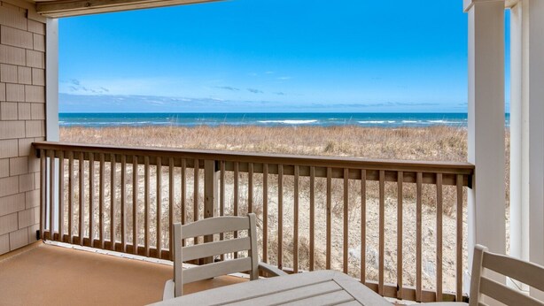 A covered outdoor area with a view of the beach and ocean. - DS203 Ocean-Front Condo with Pool and Ocean Views! (Nags Head)