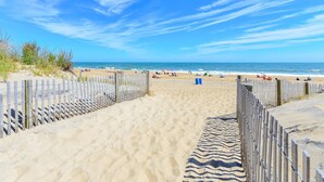 A sandy beach path leading to the ocean with wooden fences on either side. - 🏖️ 5 Bedroom Penthouse Ocean Views, Renovated, Pool, Stunning Ocean Views🏖️ (Ocean City)