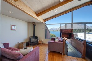 Flat-screen TV, fireplace, DVD player, stereo