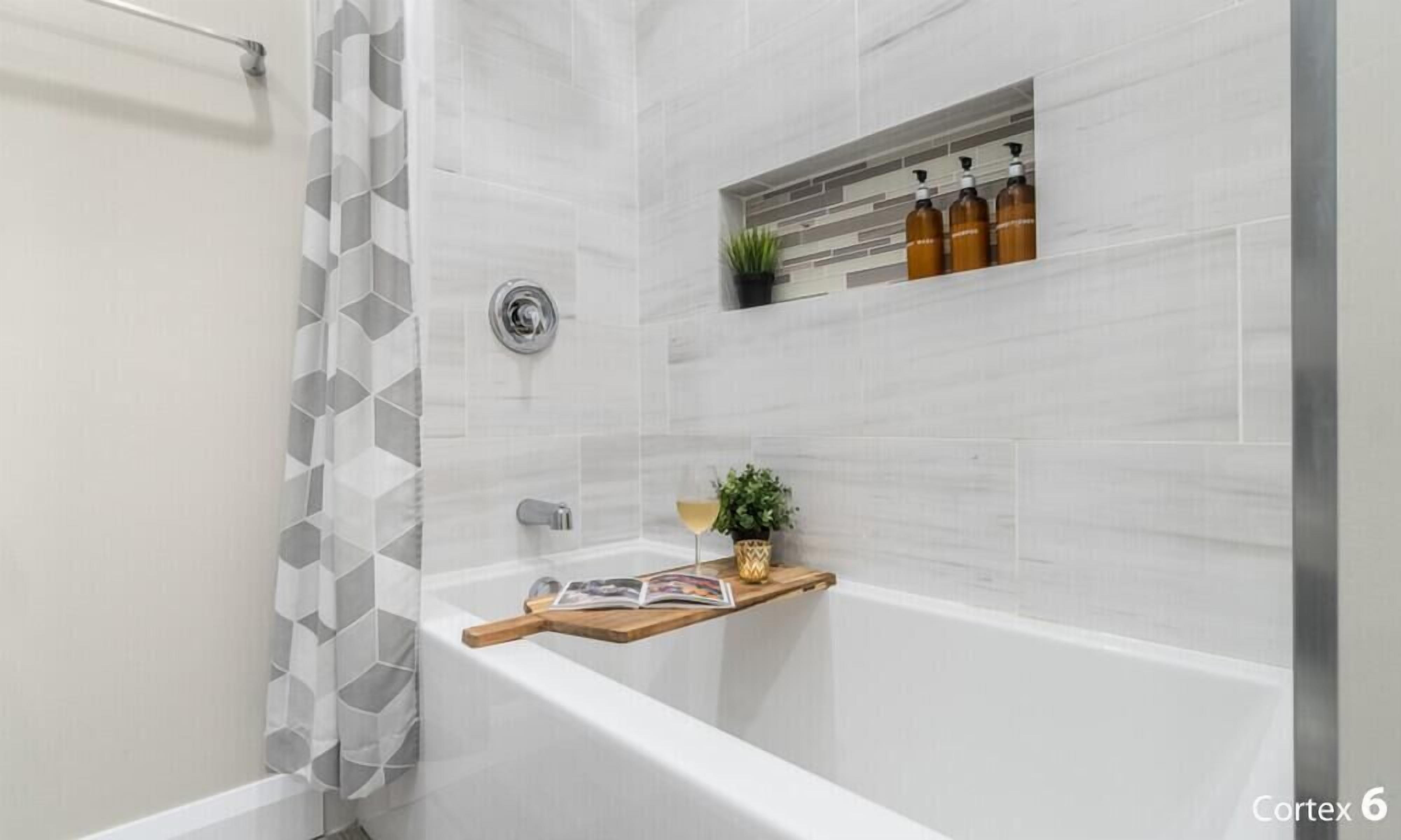 Combined shower/tub, hair dryer, towels, soap
