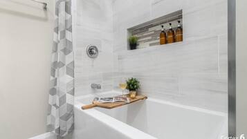 Combined shower/tub, hair dryer, towels, soap