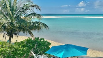 On the beach, sun loungers, beach towels