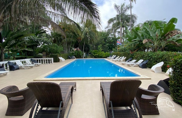 Outdoor pool, open 8:00 AM to 8:30 AM, pool loungers