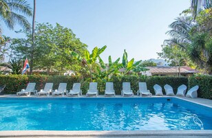 Outdoor pool, open 8:00 AM to 8:30 AM, pool loungers