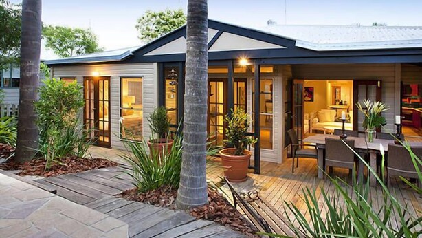 A modern house with a patio, large windows, and a dining area. - "Summer Salt" @ Sunshine + Pets & HEATED POOL 150m to the beach! (Noosa Heads)
