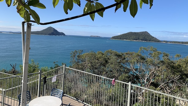 A balcony with a view of the sea and distant islands. - A beach house with colour! (Shoal Bay)