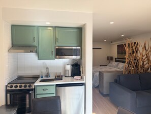 Fridge, microwave, stovetop, coffee/tea maker